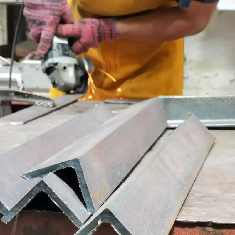 Metal Processing With Angle Grinder Man Cutting Mild Steel Angle Bars Min | ALSIMETAL SL